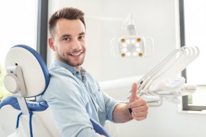 dental patient giving thumbs up