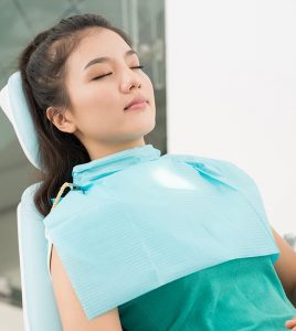 Female patient sedated at dentist