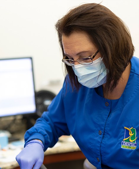 Henderson dental team member treating dental patient