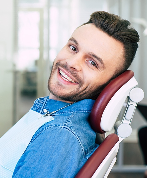 Smiling man in dental chair