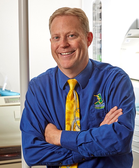 Doctor Noorda smiling with arms crossed