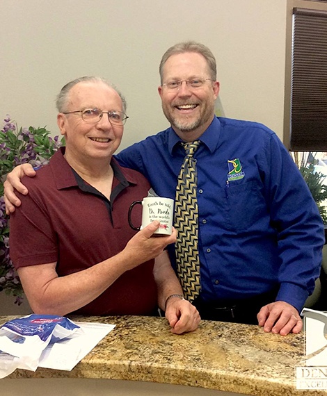 Doctor Noorda smiling with Henderson dental patient