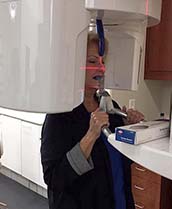 Dental patient having a 3 D scan taken of her mouth and jaw