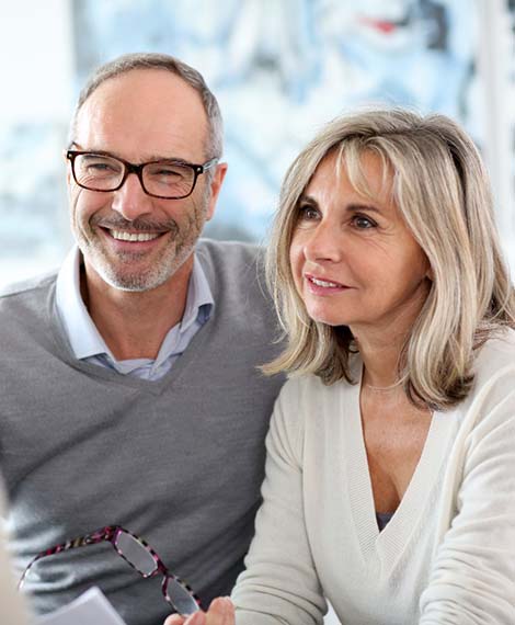 Man and woman asking their dentists questions