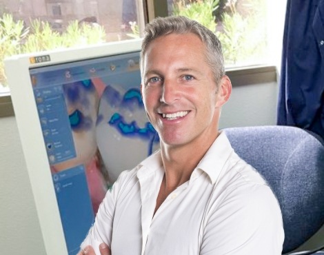 Man with flawless smile after CEREC one visit dental crown restoration