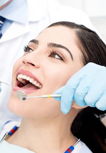 Woman getting dental checkup 