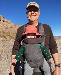 Doctor Noorda and his granddaughter on a hike