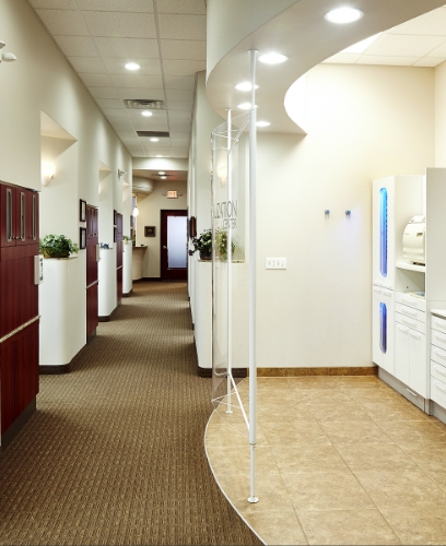 Patient talking with team member at front desk