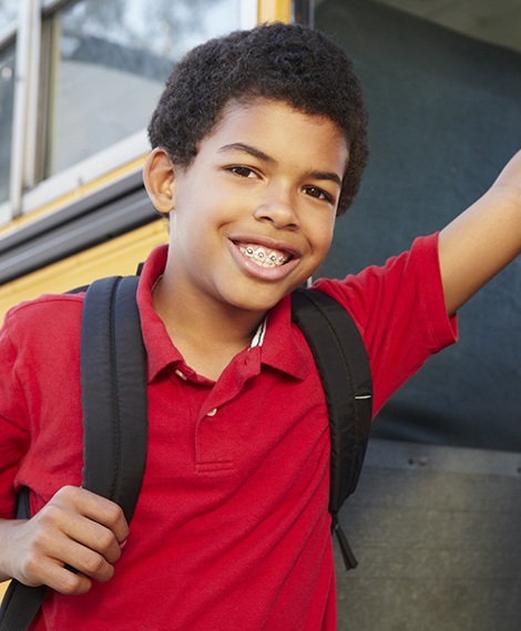 Preteen boy with traditional braces