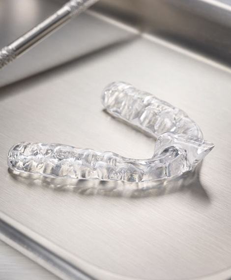 Clear nightguard for bruxism on metal tray