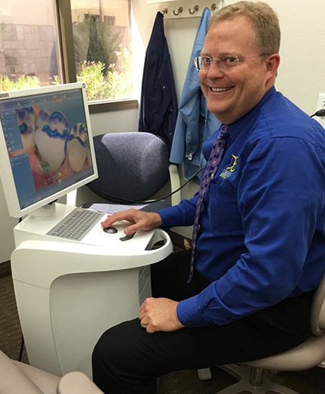 Doctor Noorda using computer to design CEREC same day dental crown in Henderson