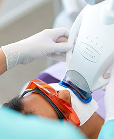 Dental patient receiving Zoom in office teeth whitening in Henderson