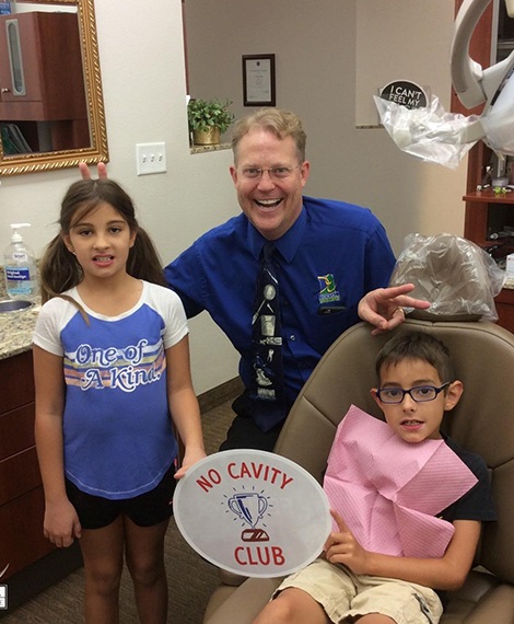 Doctor Noorda and two young patients in dental treatment room