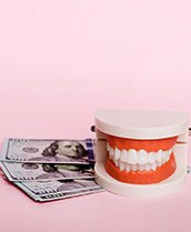 fake teeth and money